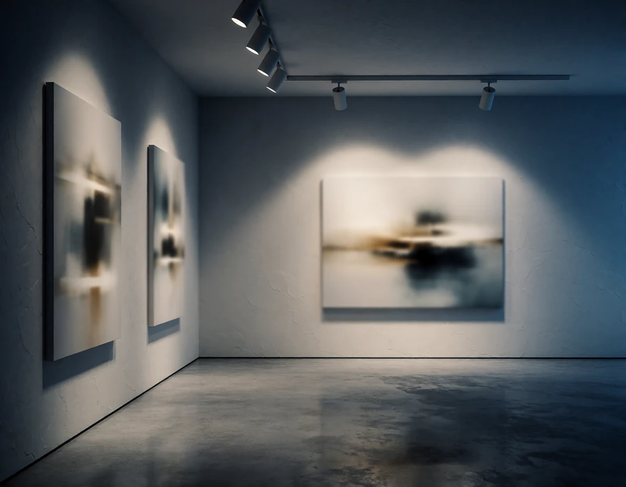 Private contemporary art gallery room with pale walls, polished concrete floor and focused spotlighting